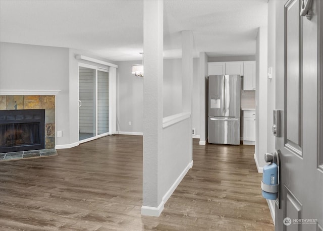 interior space featuring a textured ceiling and dark hardwood / wood-style flooring