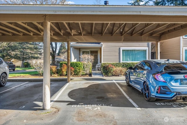 view of parking / parking lot with a carport