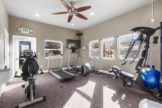 workout room with ceiling fan and carpet flooring