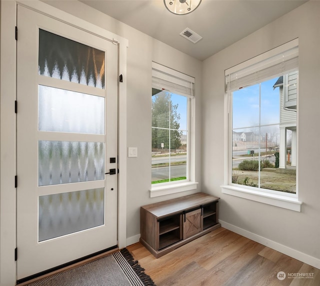 entryway with light hardwood / wood-style floors