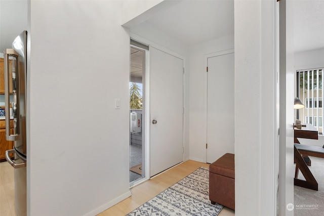 foyer with light hardwood / wood-style floors