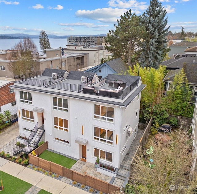 birds eye view of property featuring a water view