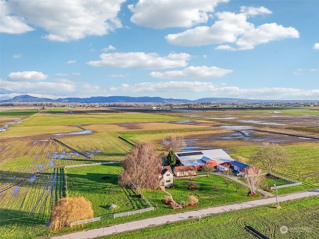 birds eye view of property featuring a mountain view and a rural view