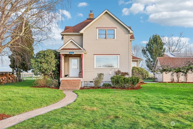 view of front property with a front lawn