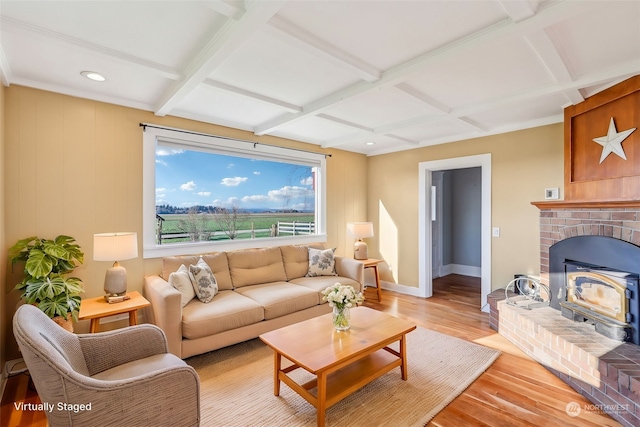 living room with beam ceiling, light hardwood / wood-style flooring, and coffered ceiling