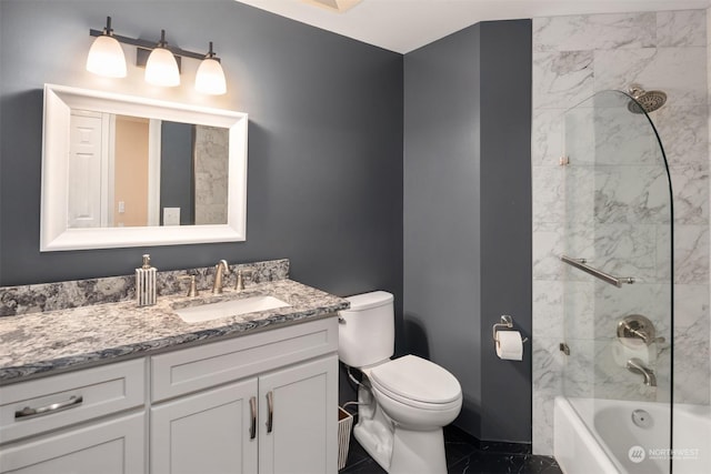 full bathroom with toilet, vanity, and tiled shower / bath combo