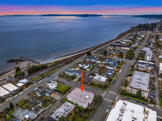 aerial view at dusk with a water view