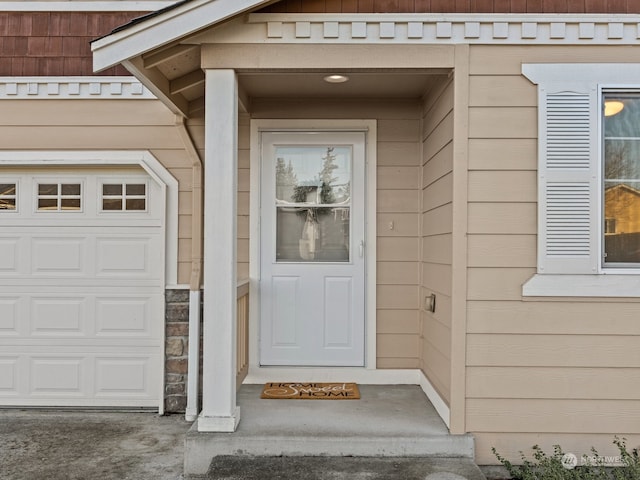 entrance to property featuring a garage