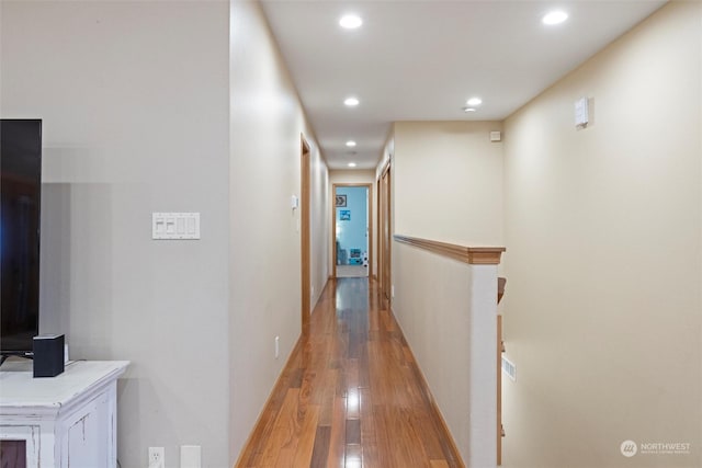 corridor featuring hardwood / wood-style floors