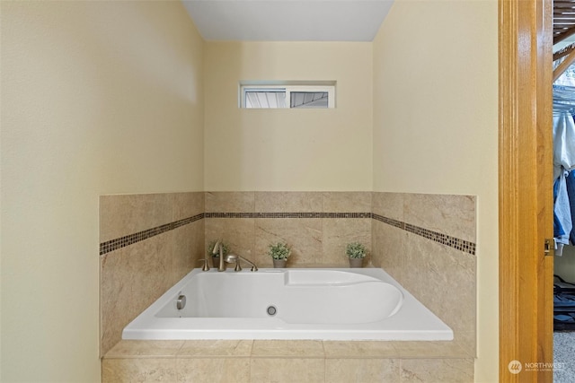 bathroom featuring tiled bath