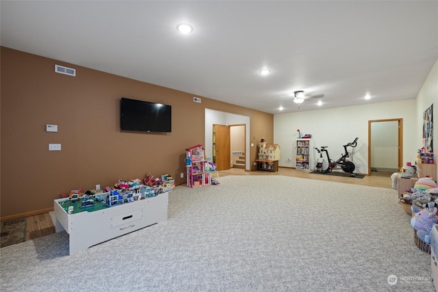 rec room with light carpet