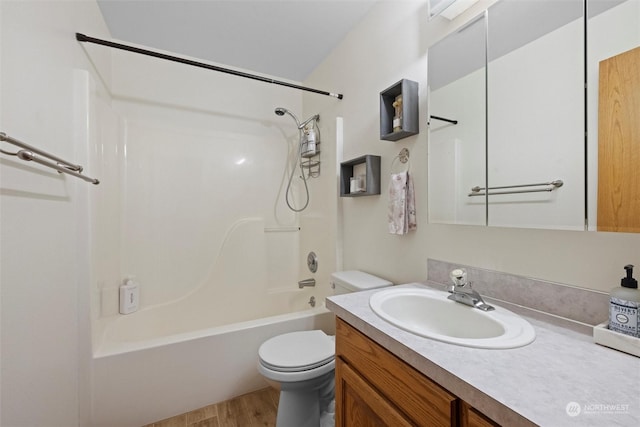 full bathroom featuring hardwood / wood-style floors, vanity, toilet, and shower / bathtub combination