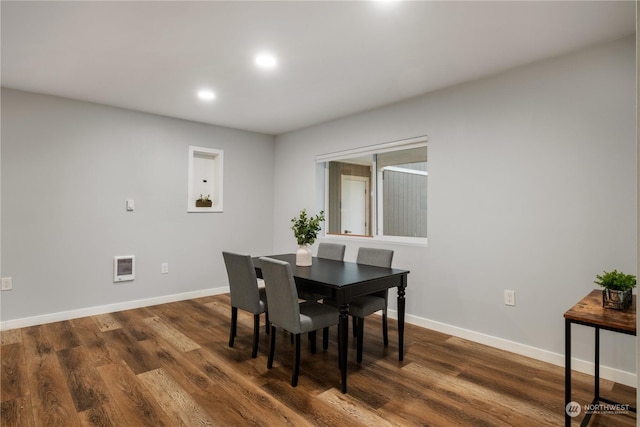 dining room with dark wood-type flooring