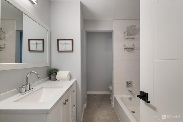 full bathroom featuring washtub / shower combination, tile patterned flooring, vanity, and toilet