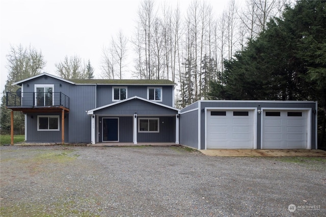 view of front property with a balcony and a garage