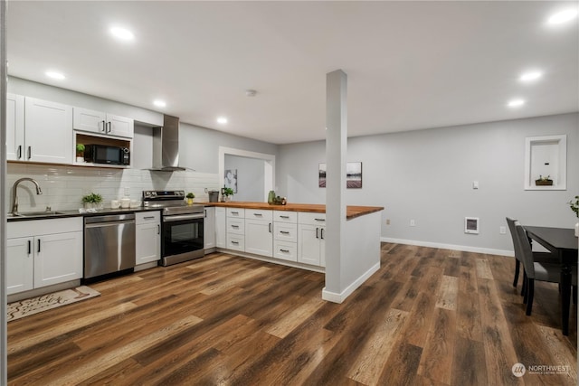 kitchen with white cabinetry, sink, wall chimney exhaust hood, and stainless steel appliances