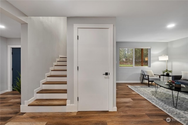 staircase featuring wood-type flooring