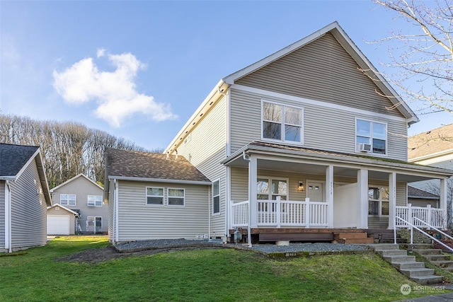 view of front of home with a garage, covered porch, an outdoor structure, and a front lawn