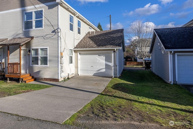 view of property exterior with a garage and a yard