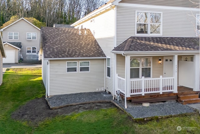 exterior space with a porch and a yard