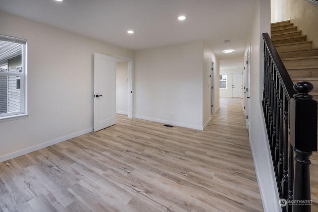 spare room with light wood-type flooring