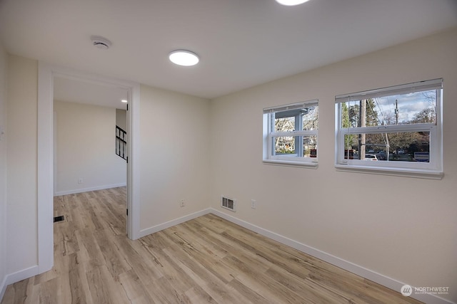 unfurnished room featuring light wood-type flooring