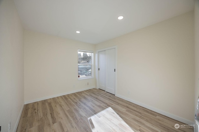 spare room featuring light hardwood / wood-style flooring