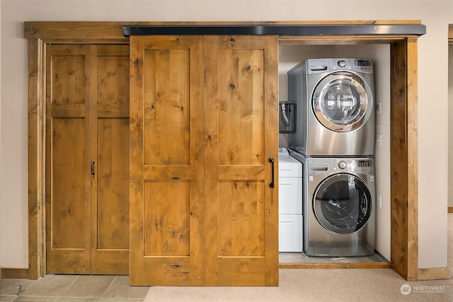 laundry room with stacked washer / dryer