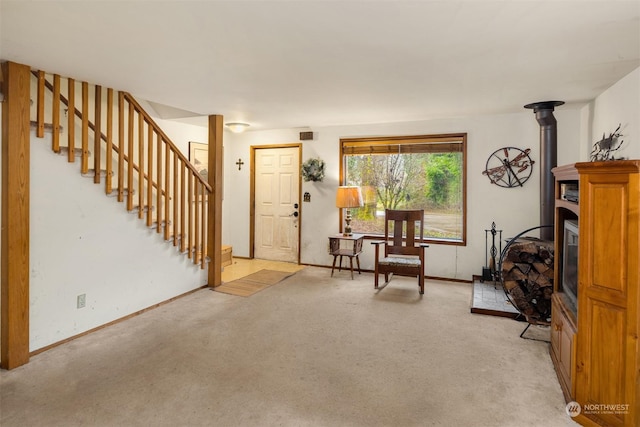 living area featuring light colored carpet