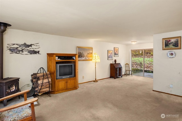 carpeted living room featuring a wood stove