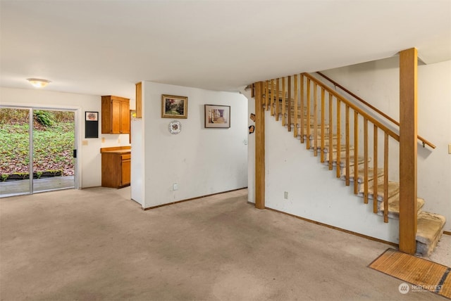 unfurnished living room with light carpet