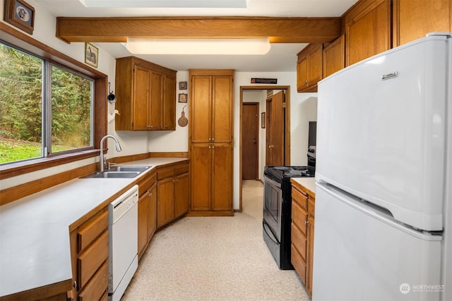 kitchen with white appliances and sink