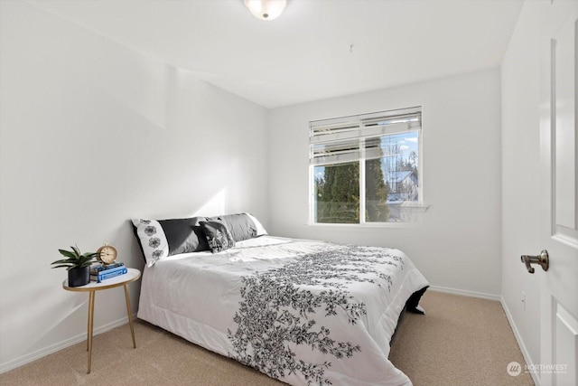 bedroom featuring light colored carpet