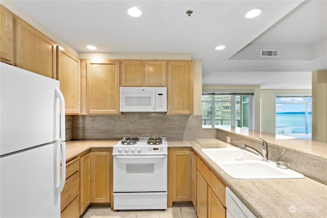 kitchen with white appliances, sink, decorative backsplash, light brown cabinetry, and light tile patterned flooring