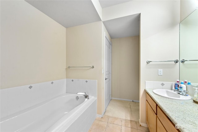 bathroom featuring vanity, tile patterned floors, and tiled tub