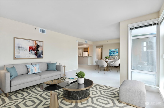 living room with light colored carpet