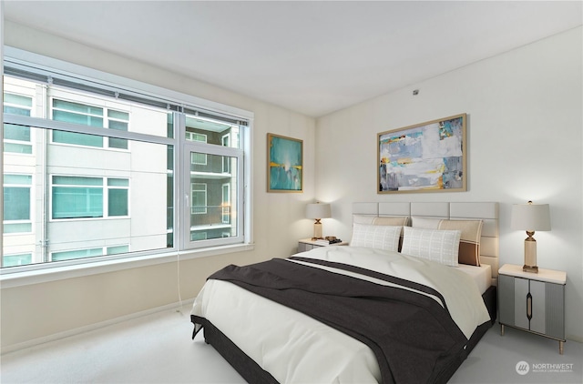 bedroom with carpet and multiple windows