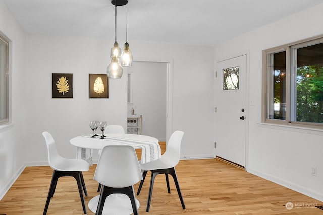 dining space with light wood-type flooring