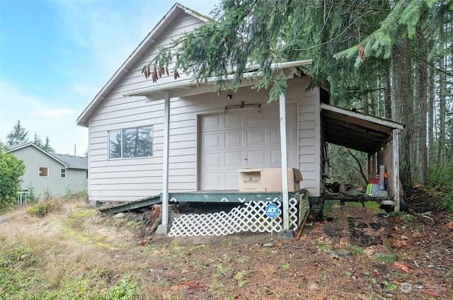 view of side of property featuring a garage