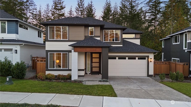 view of front facade featuring a lawn and a garage