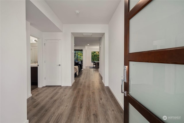 hallway featuring hardwood / wood-style flooring