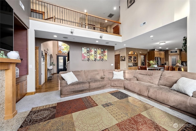 living room with a towering ceiling