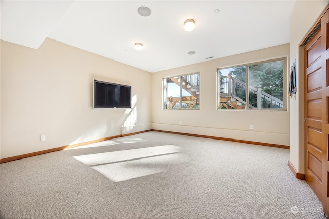 unfurnished living room with light carpet