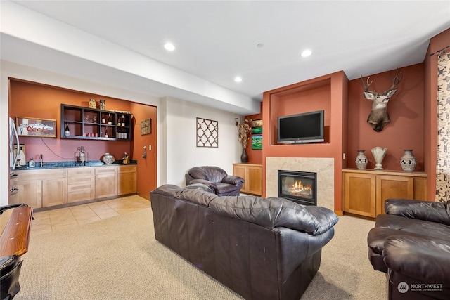 living room with light colored carpet and indoor wet bar