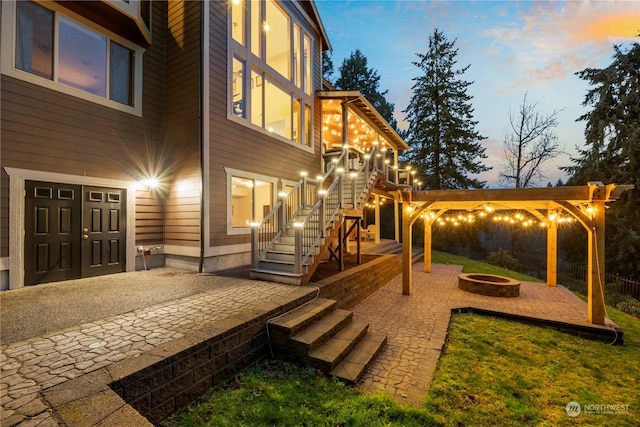 exterior space featuring an outdoor fire pit