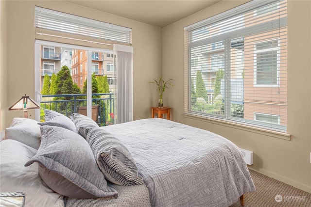 bedroom with access to exterior and carpet flooring