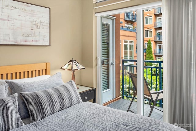 bedroom featuring access to exterior and multiple windows