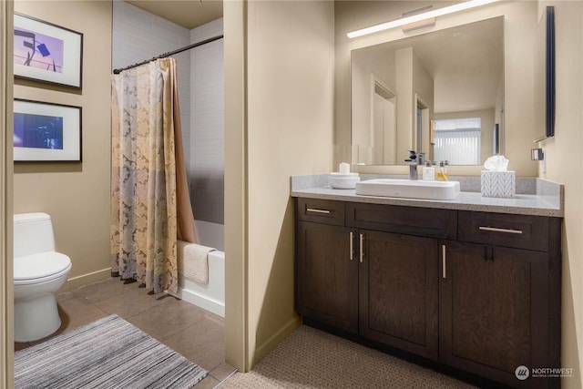 full bathroom featuring toilet, vanity, shower / tub combo with curtain, and tile patterned floors