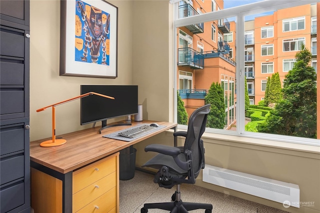 home office with a baseboard heating unit