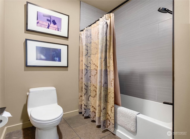 bathroom with toilet, tile patterned floors, and shower / bath combo with shower curtain